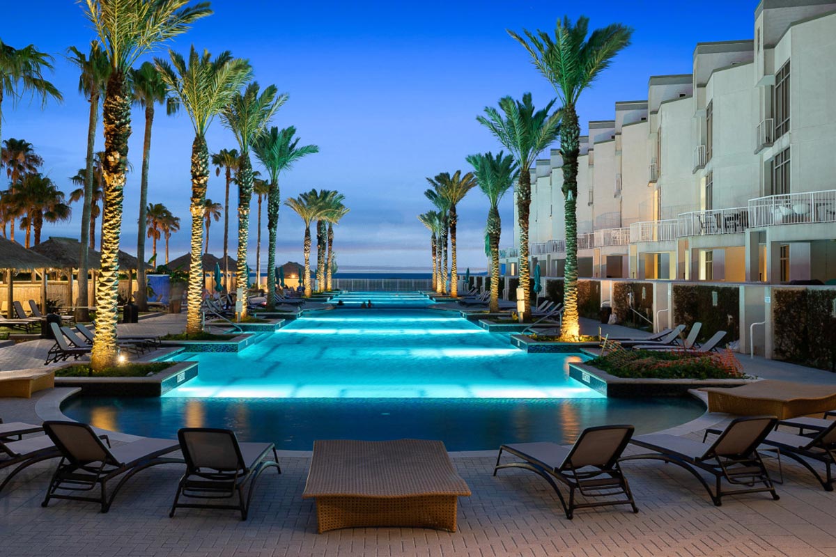 Sapphire Tower beachfront pools and resort grounds from above, South Padre Island