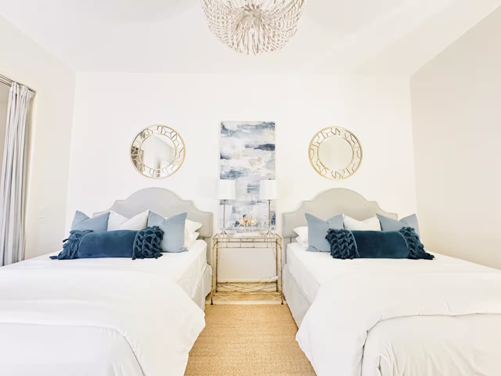 Guest bedroom with two beds and coastal decor at Casa Cova, South Padre Island