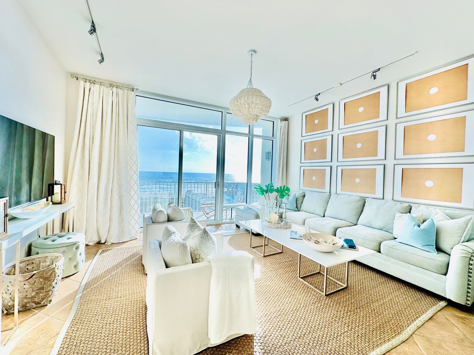 Casa Cova living room with floor-to-ceiling Gulf views and coastal decor, Sapphire Tower South Padre Island
